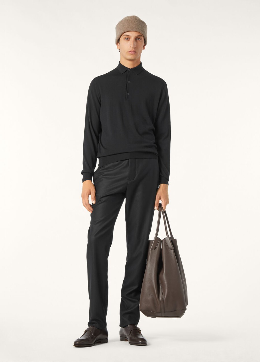 het zwarte poloshirt van the gift of kings